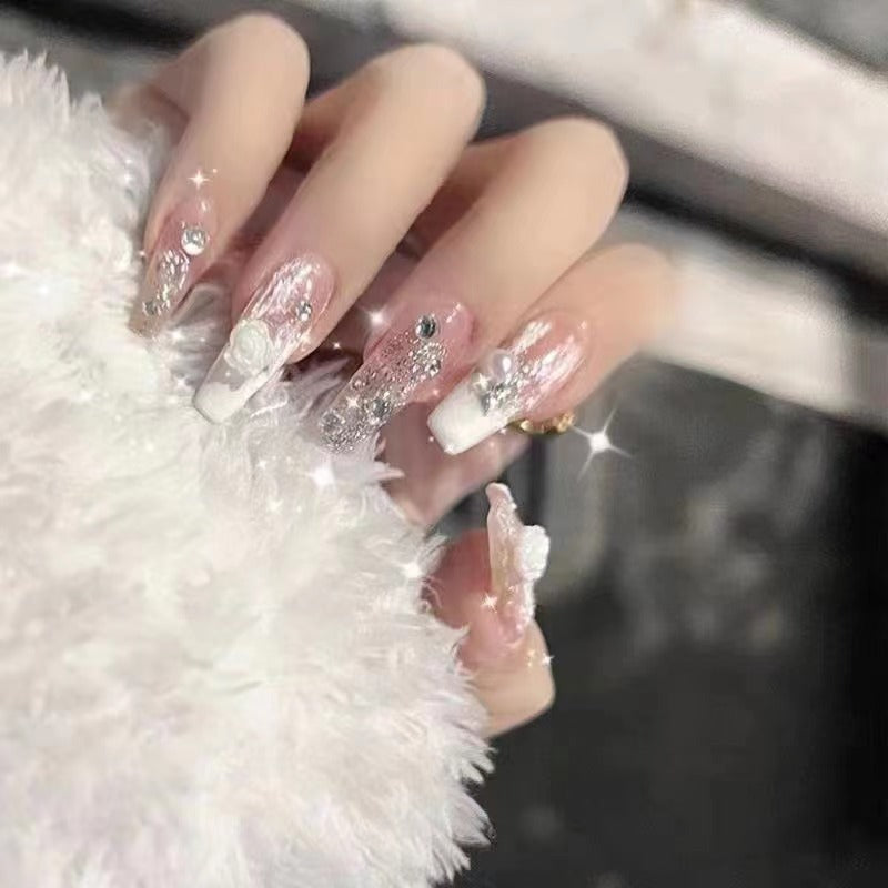 Elegant artificial nails with glitter and flower decoration Stornfield