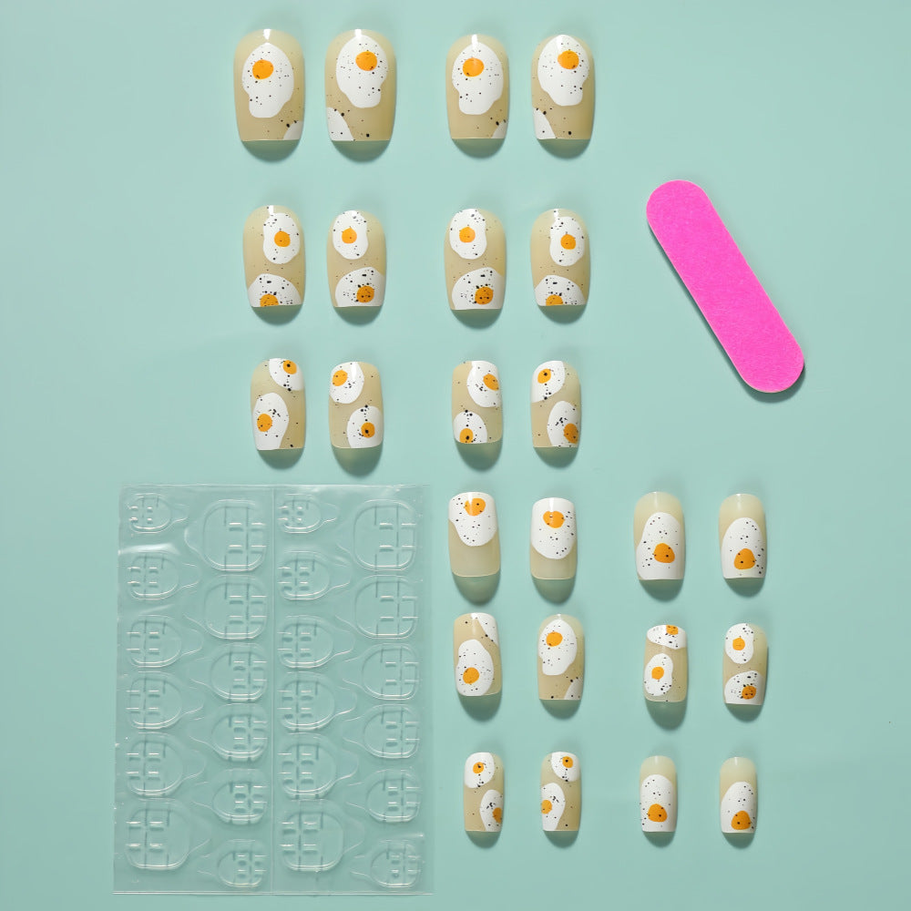 Artificial nails in creative fried egg design Stornfield