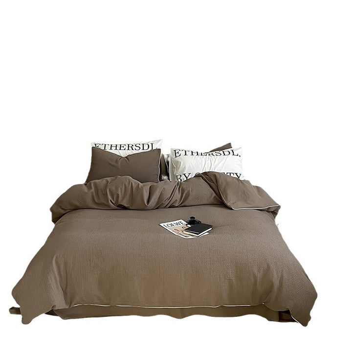 Textured cotton waffle duvet cover with pillowcases and fine contrasting piping