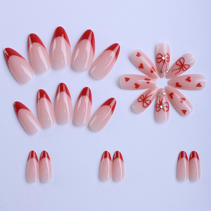 Artificial nails with elegant heart designs and glamorous accents Stornfield