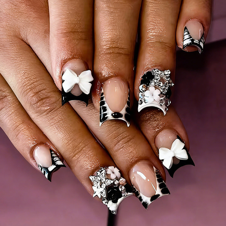 Elegant artificial nails with detailed embellishments Stornfield