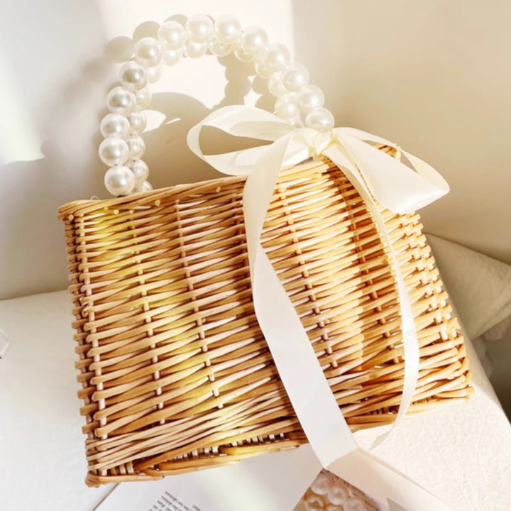Ladies handbag made of braided material with elegant pearl handles Stornfield