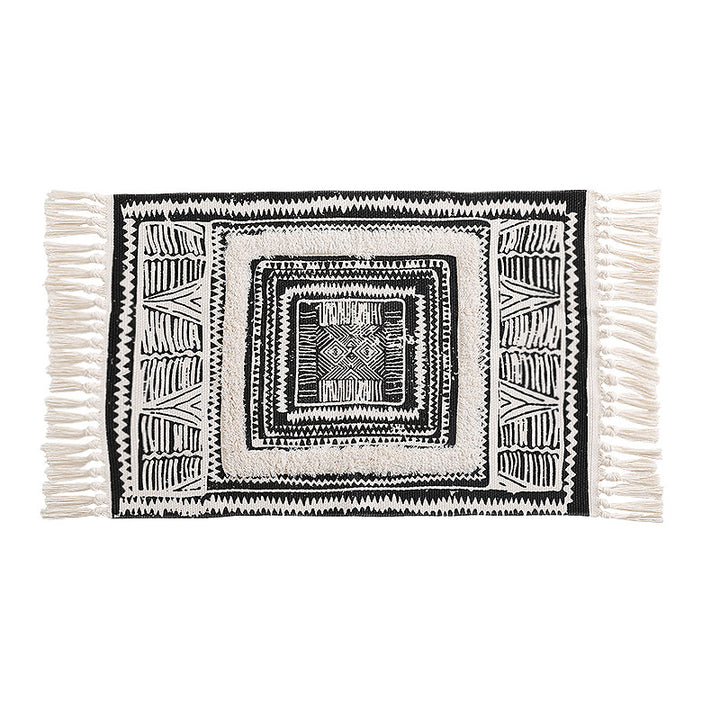 Flat Boho runner rug made of cotton blend fabric with geometric hexagon tufting and decorative fringed edge.