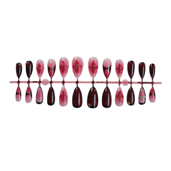 Artificial nail set with elegant flower and glitter decorations Stornfield