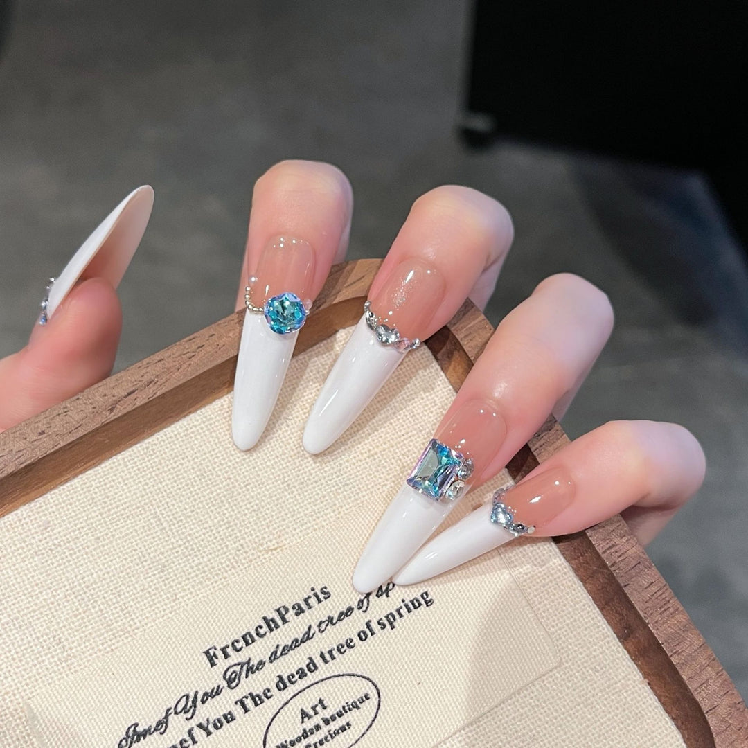 Artistic Stiletto Press-On Nail Art with Glimmering Accents Stornfield