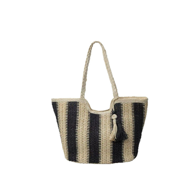 Handcrafted straw bag with elegant tassels and detailed texture Stornfield