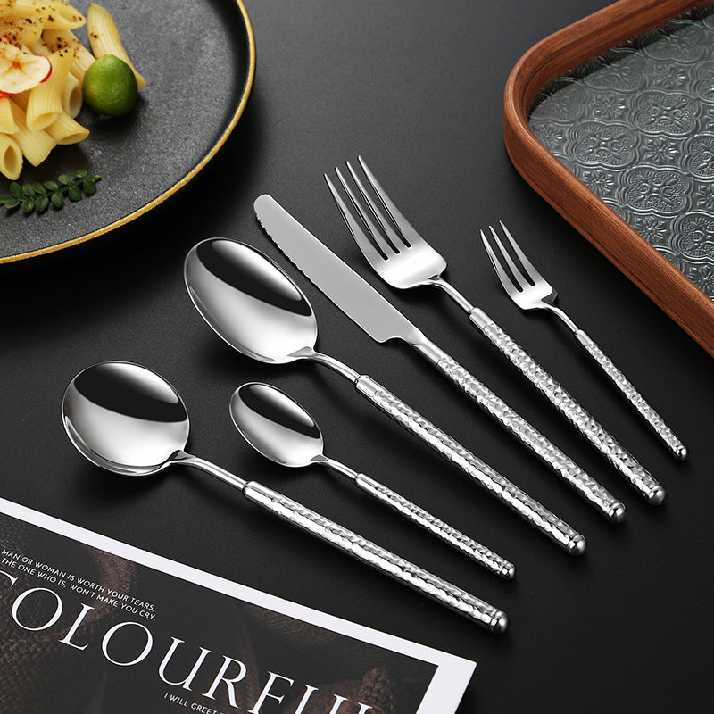 Elegant dessert spoon with elaborate handle design Stornfield