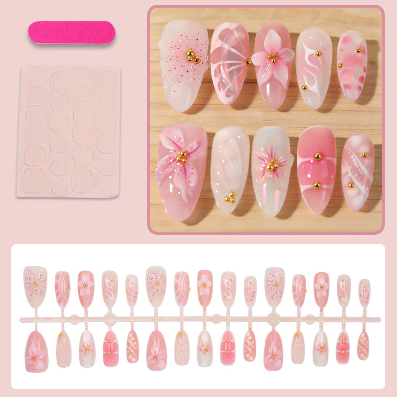 Artificial nails with floral designs and glitter accents Stornfield