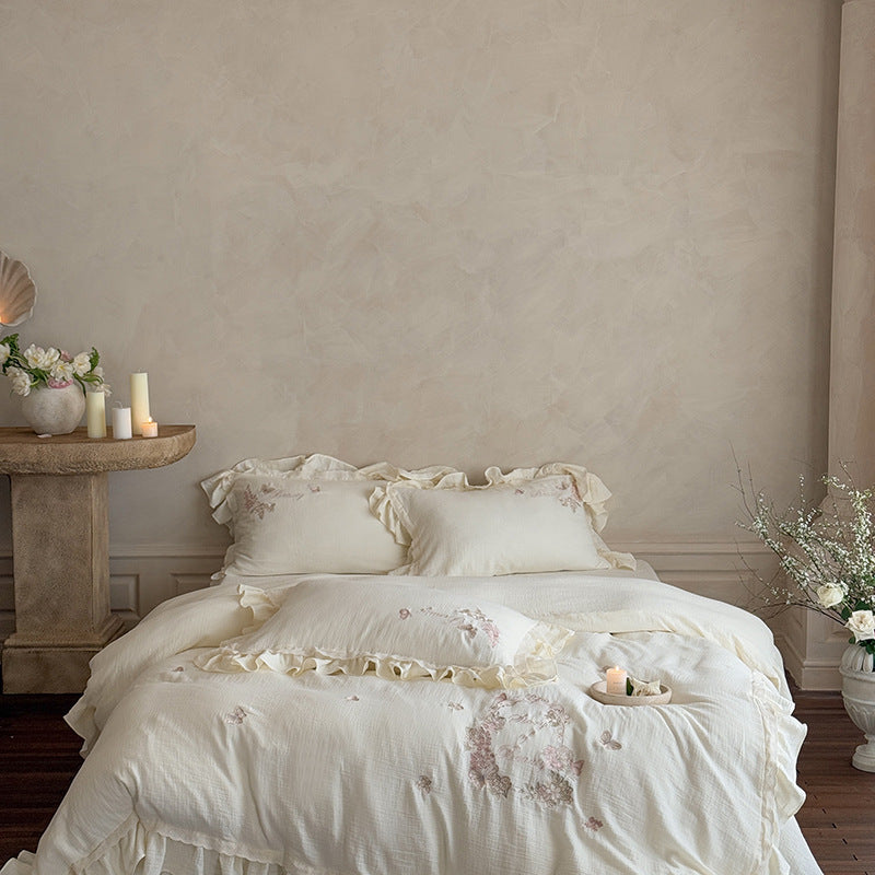 Embroidered cotton muslin bedding set with ruffle and floral watercolor embroidery design Stornfield
