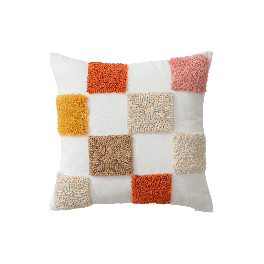 Decorative pillow with textured square appliqués and cotton cover