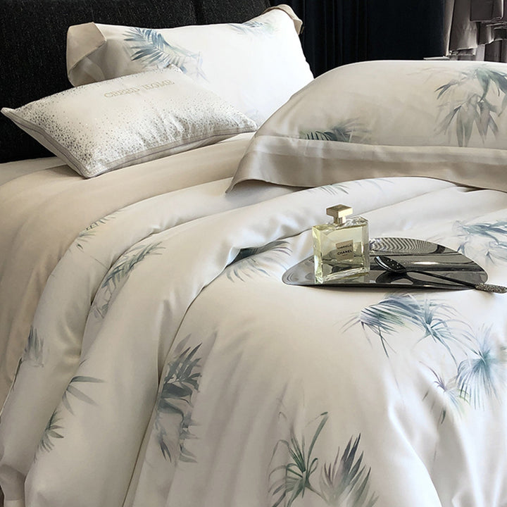 Luxurious cotton satin bedding set with delicate leaf print, contrasting hem and fine piping