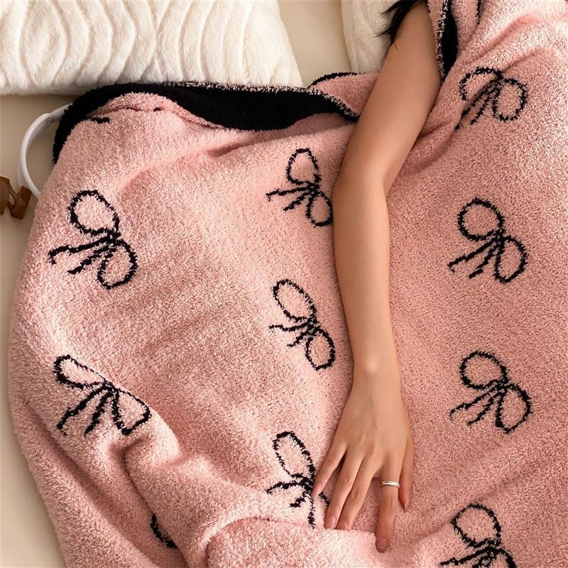 Reversible cuddly blanket made of terry cloth with decorative dog motif