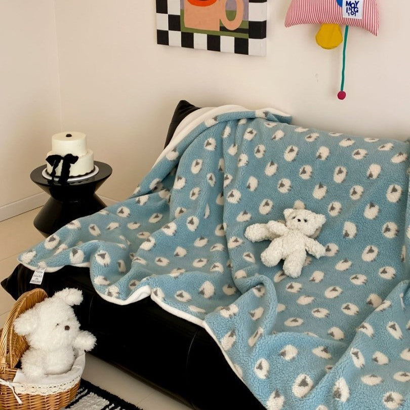 Plush Sherpa throw blanket with abstract pattern and extra-soft teddy fleece