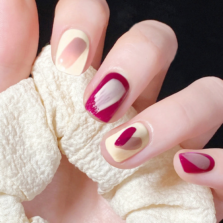Artful nail extensions with an elegant leaf pattern Stornfield