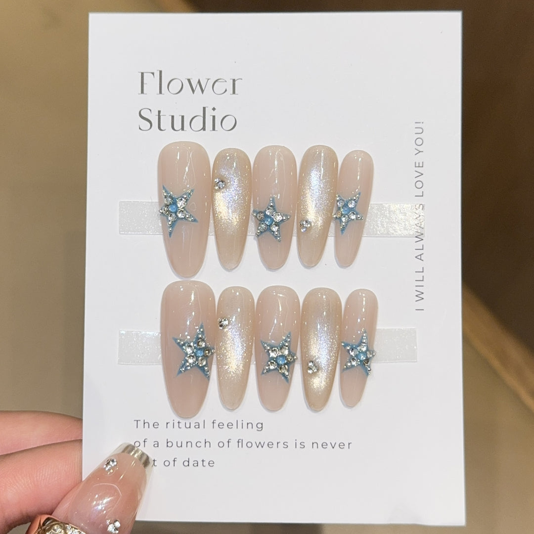Glamorous artificial nails with star accents Stornfield