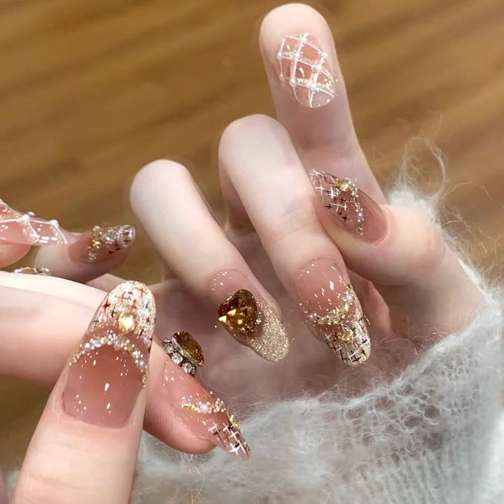 Artificial nails with glitter and heart accents Stornfield