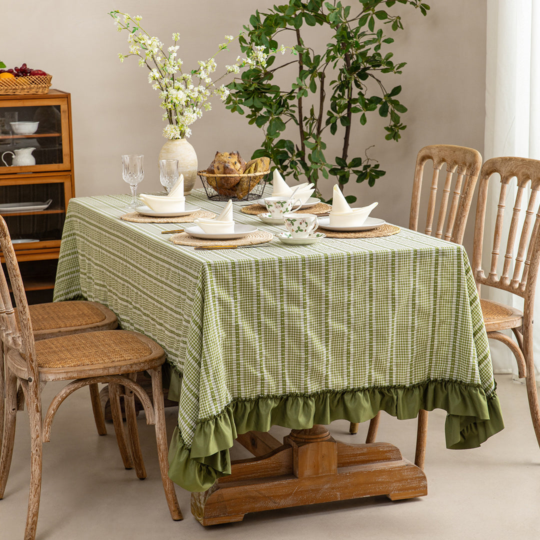 Rustic country house tablecloth made of cotton blend fabric with fine check pattern and ruffled hem