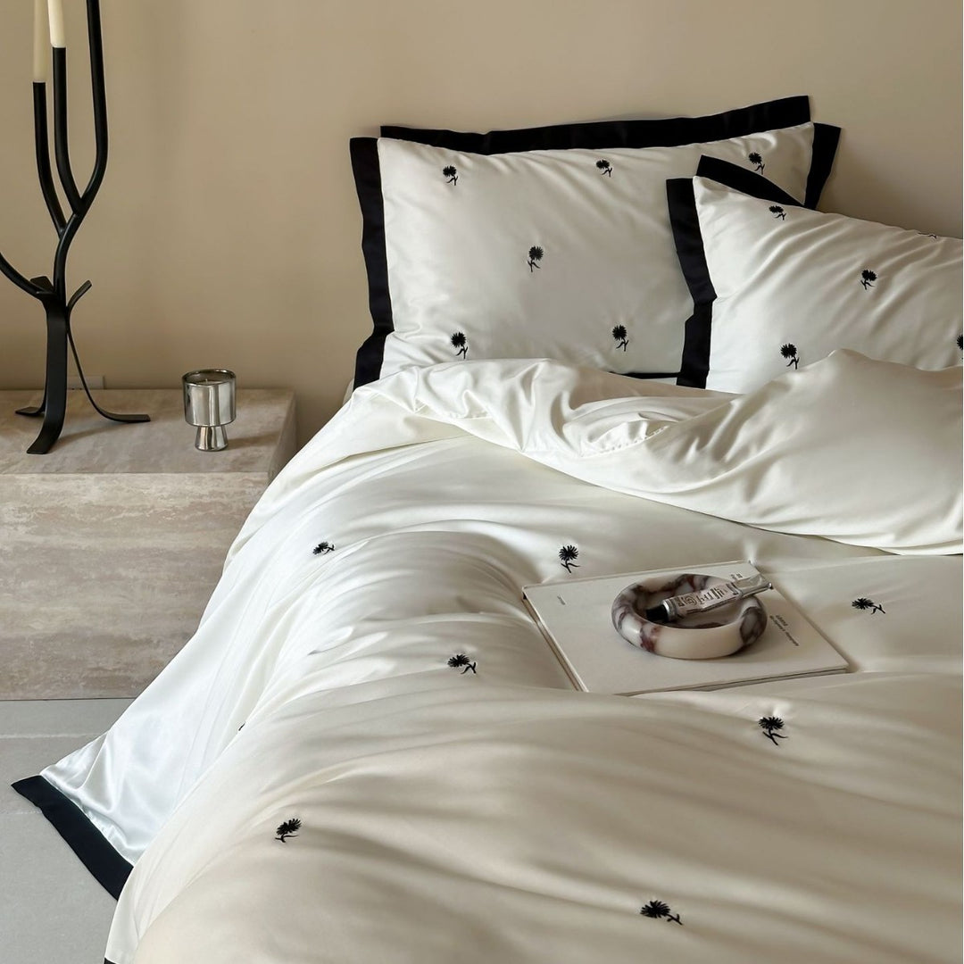 Elegant satin bed set with fine cherry embroidery and contrasting piping