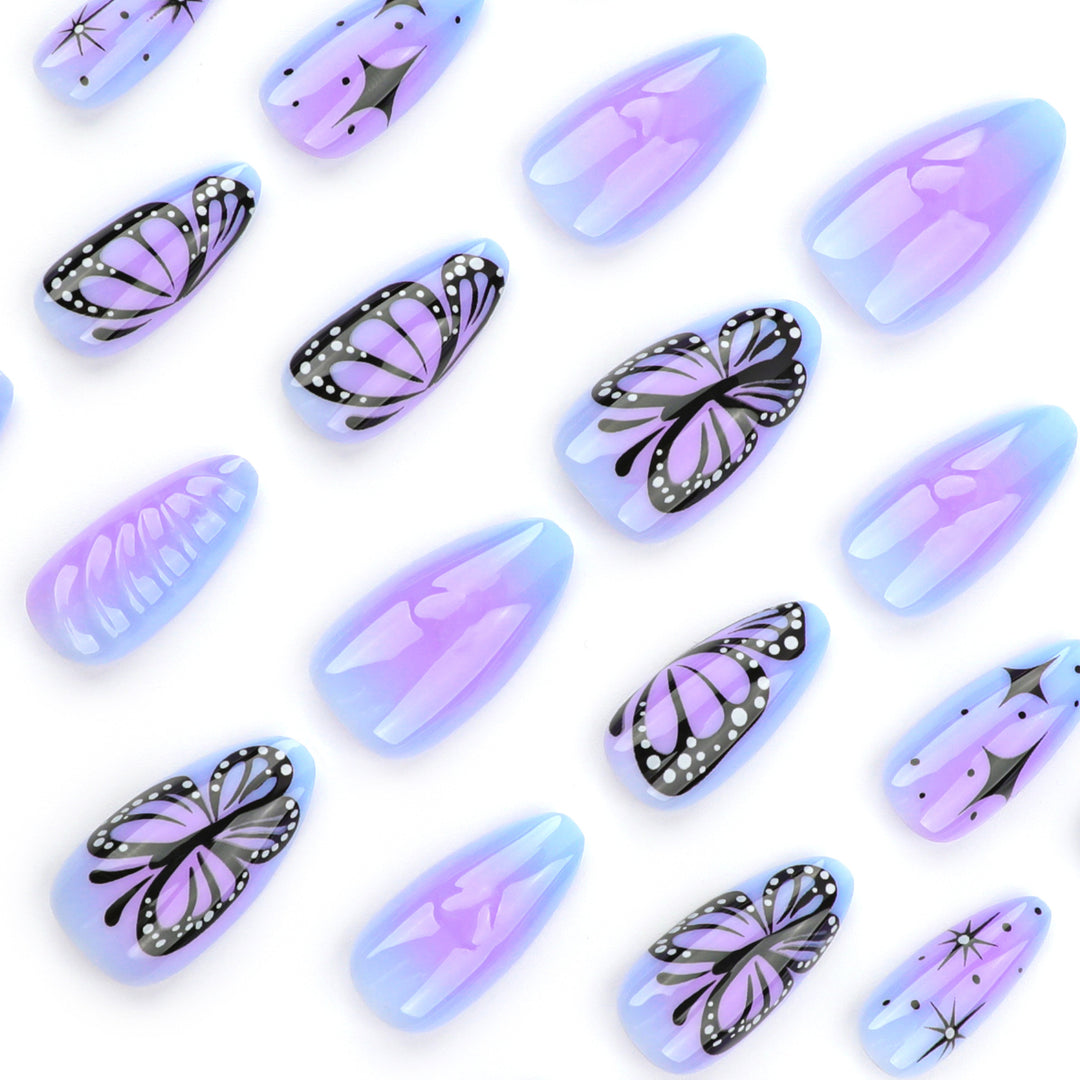 Artful stiletto nails with elegant butterfly design Stornfield