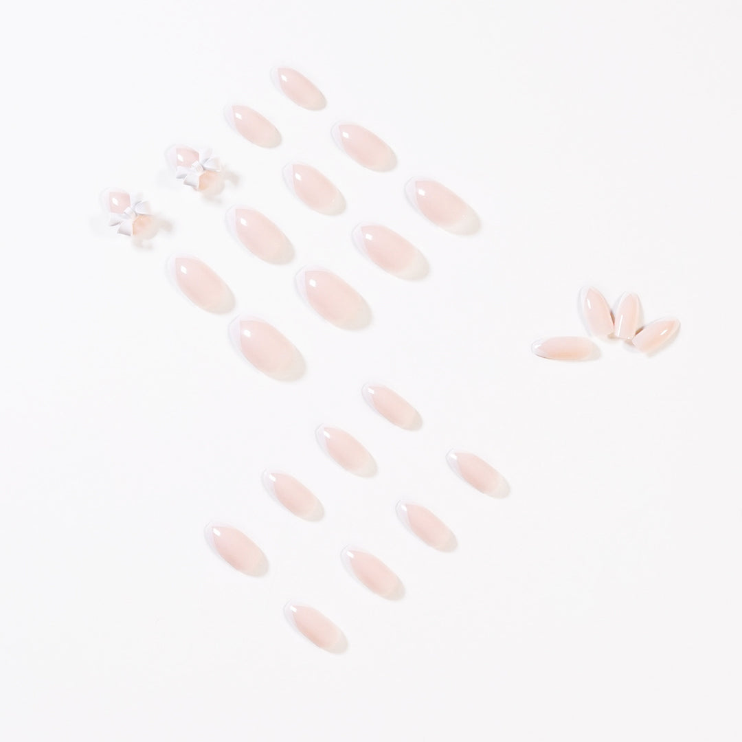 Elegant artificial nails with translucent French tip and decorative floral accents Stornfield