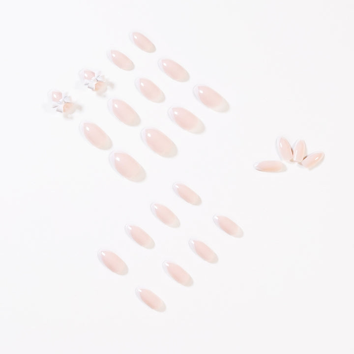 Elegant artificial nails with translucent French tip and decorative floral accents Stornfield