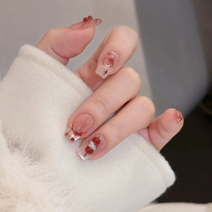 Artificial nails with playful Hello Kitty design Stornfield
