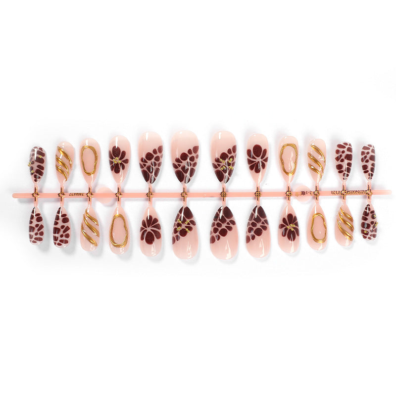 Artificial nail set with elegant flower and gold accents Stornfield