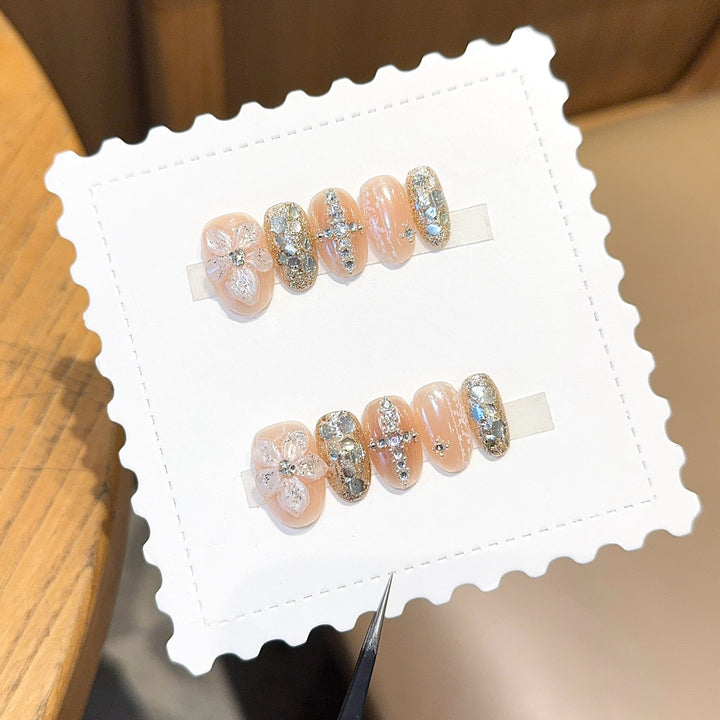 Glamorous artificial nails with floral and glittering accents Stornfield