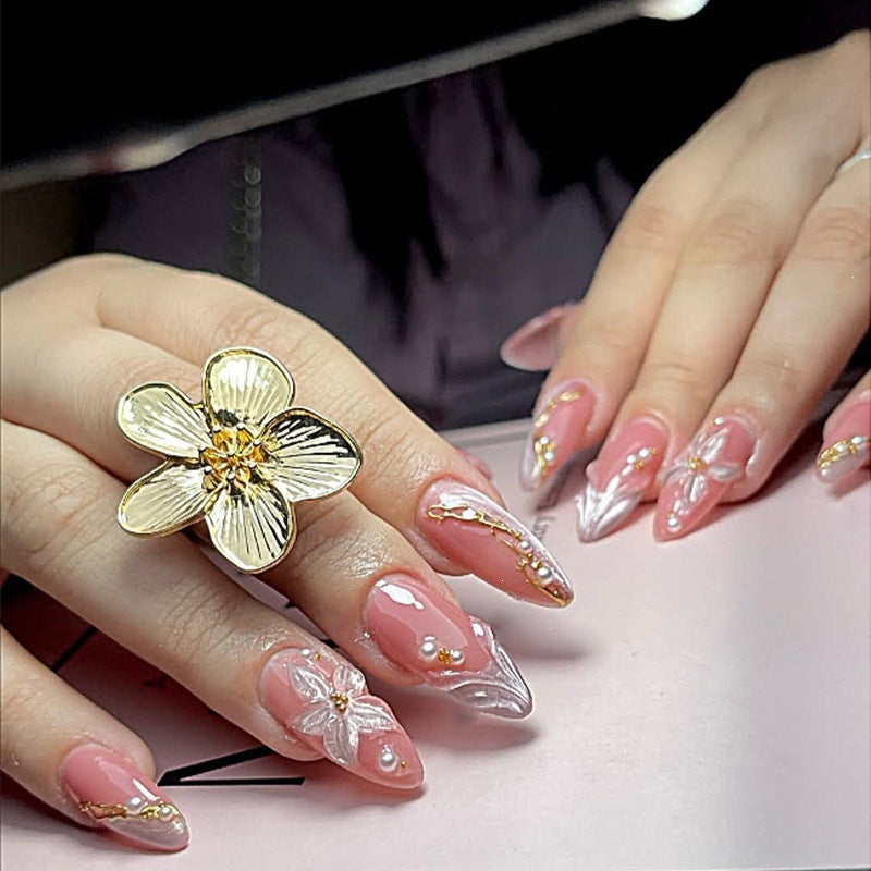 Artificial nail set with elegant silver tip design and floral accents Stornfield