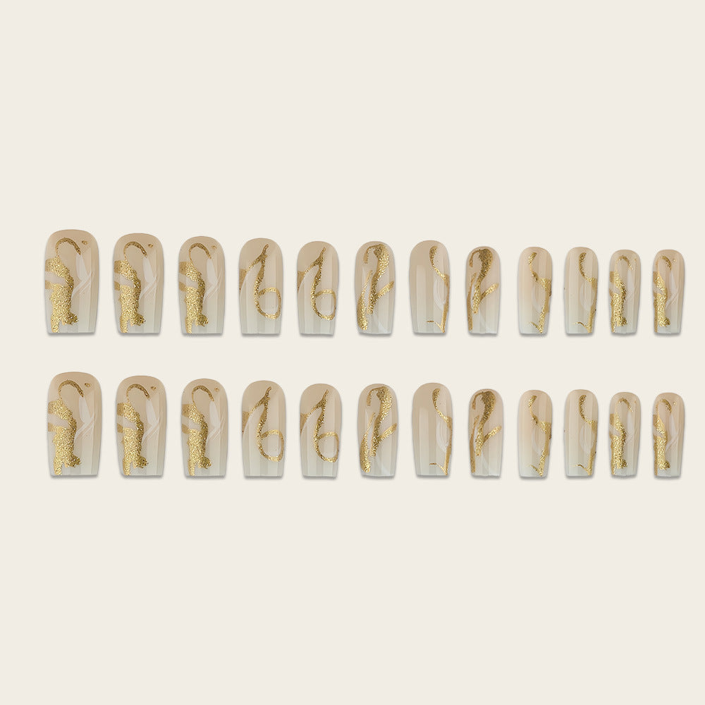 Artificial nails with elegant gold accents Stornfield