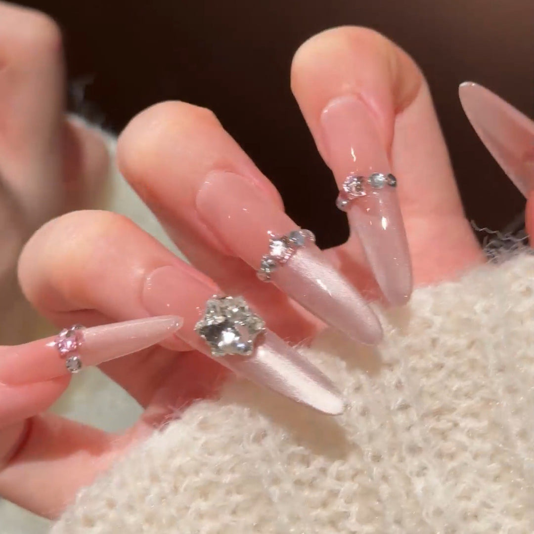Artistic Stiletto Press-On Nail Art with Glimmering Accents Stornfield