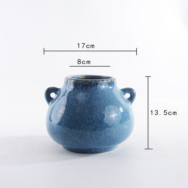 Decorative ceramic pot with playful handles Stornfield