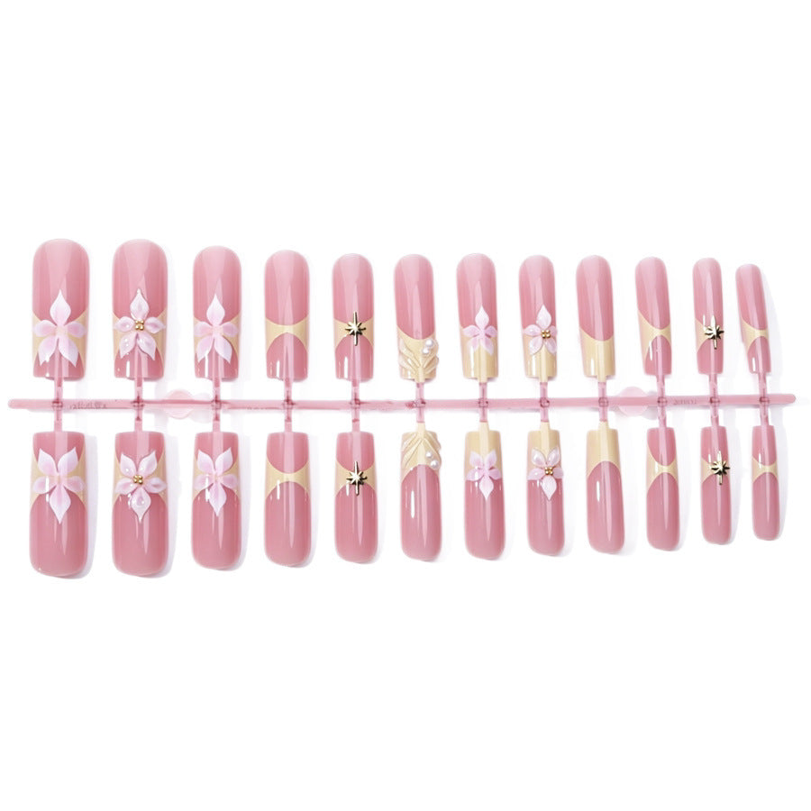 Artificial nail set with delicate flower and glitter elements Stornfield