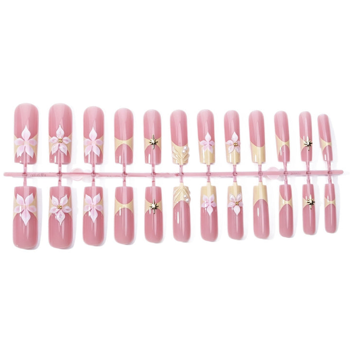 Artificial nail set with delicate flower and glitter elements Stornfield
