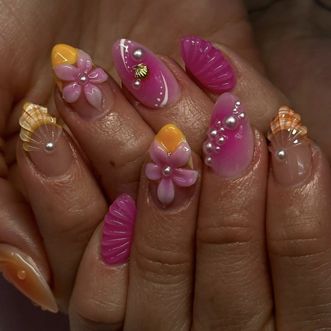 Artful nail extensions with floral and pearl-embellished accents Stornfield