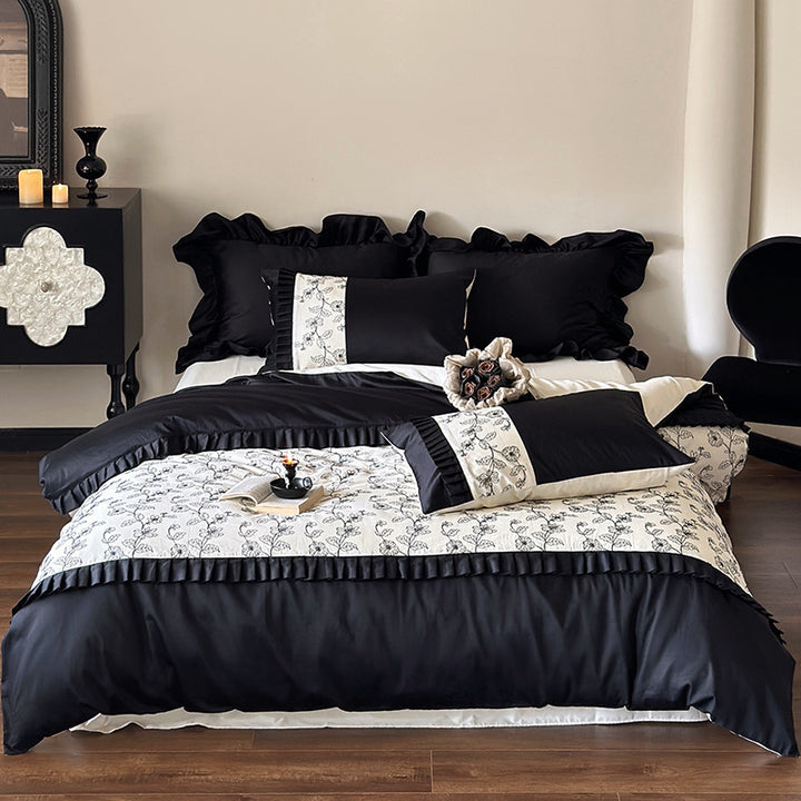 Luxurious cotton satin bedding set with ruffles and delicate floral embroidery