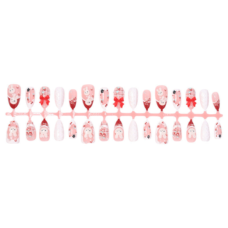 Creative acrylic nail set with playful bunny and gift designs Stornfield