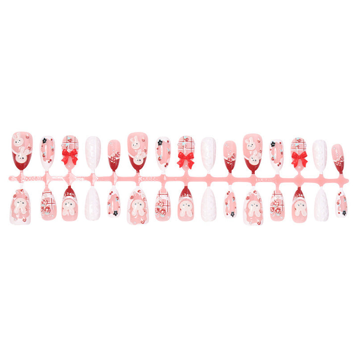 Creative acrylic nail set with playful bunny and gift designs Stornfield