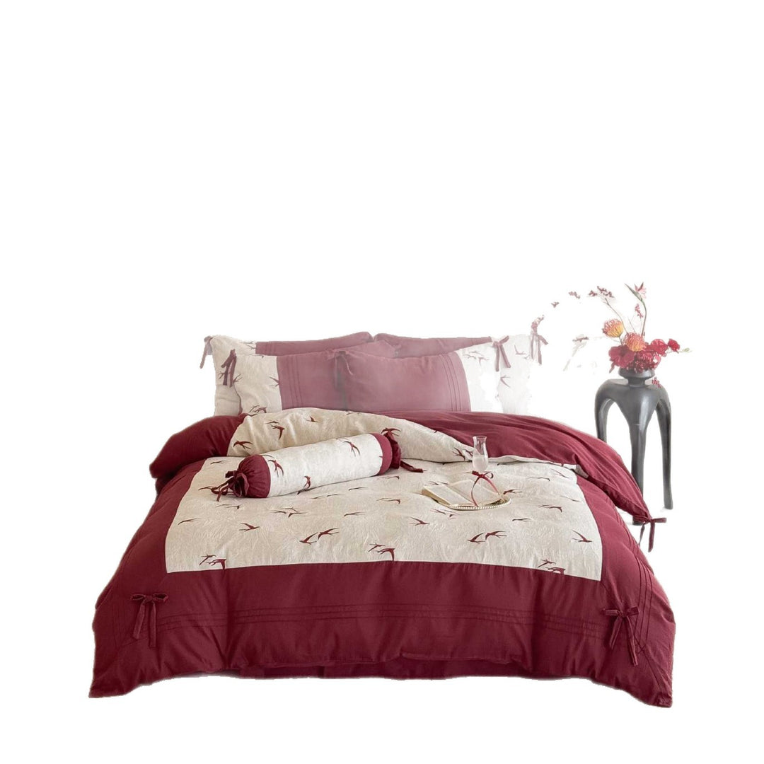 Luxurious cotton bedding set with swallow embroidery and bow accents