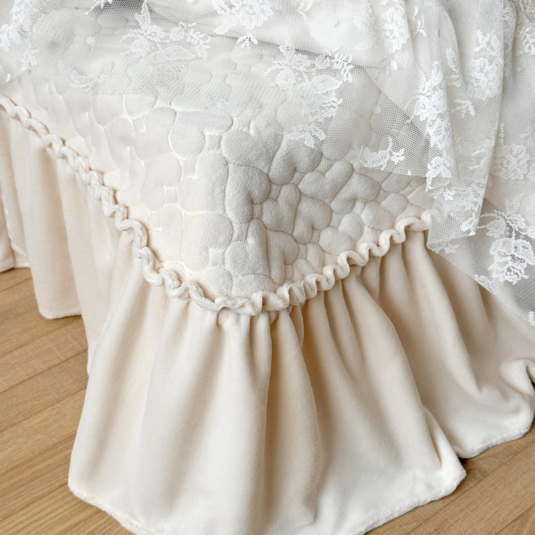 Romantic bedding set with lace trim, ruffle, and quilted blanket
