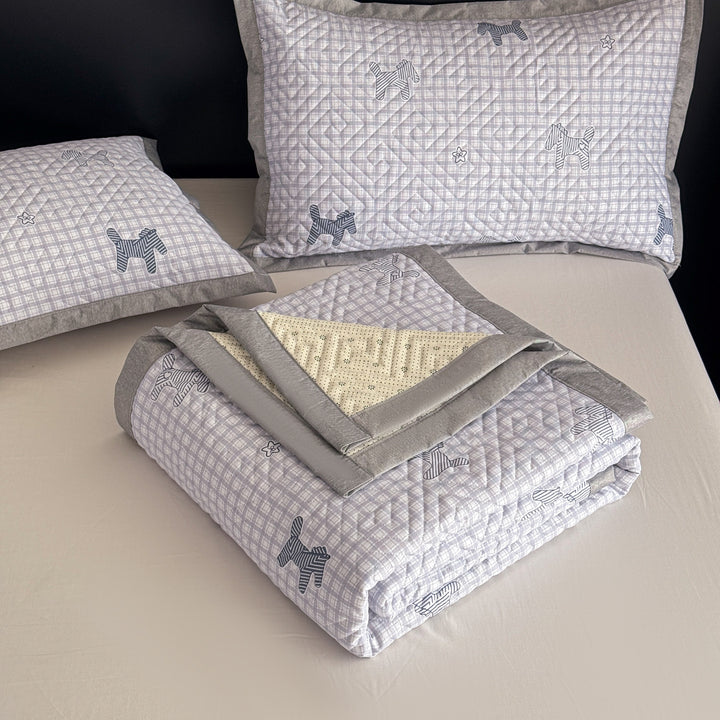 Quilted bedspread and pillow set with geometric striped quilting