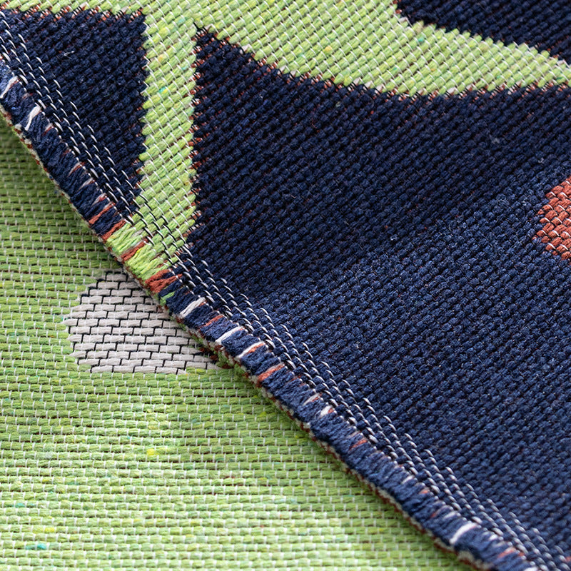 Flat-woven runner with stylized lion motif and non-slip backing