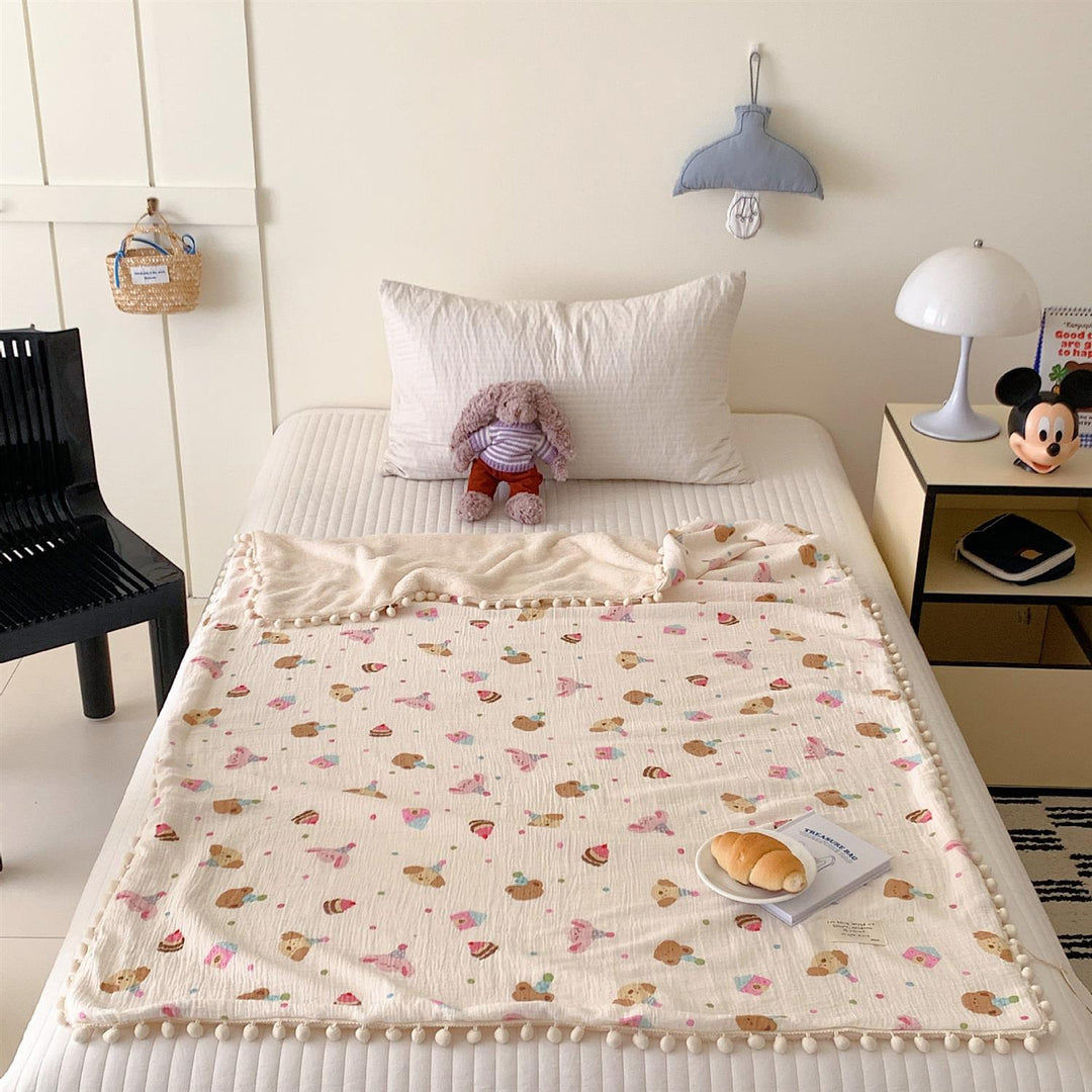 Children's Wende cuddly blanket made of cotton muslin with pompom border