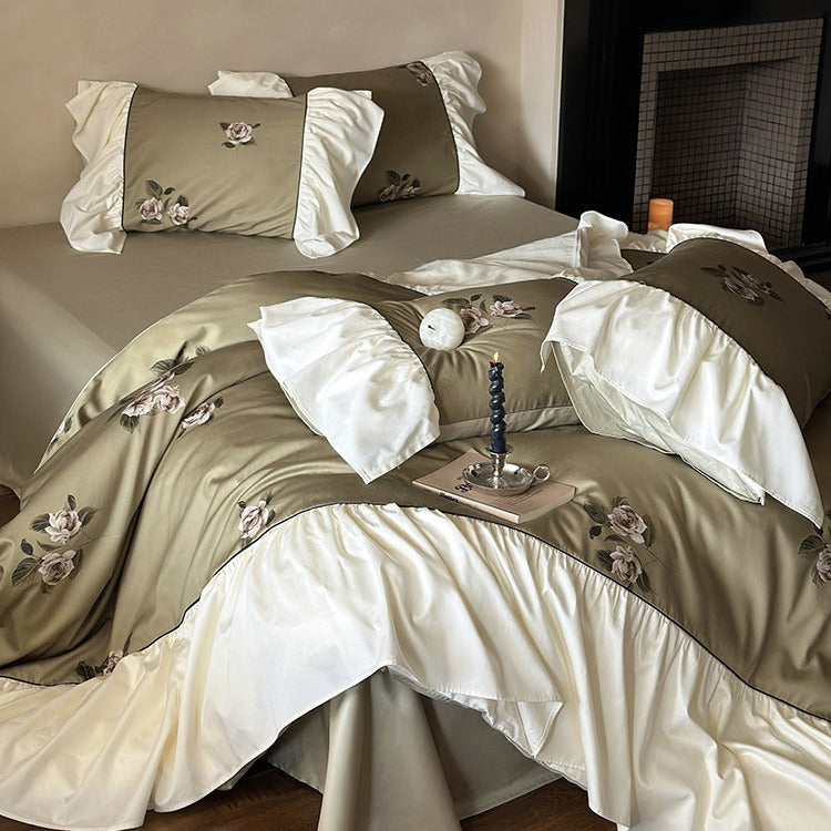 Luxurious satin bedding set with floral embroidery and frills