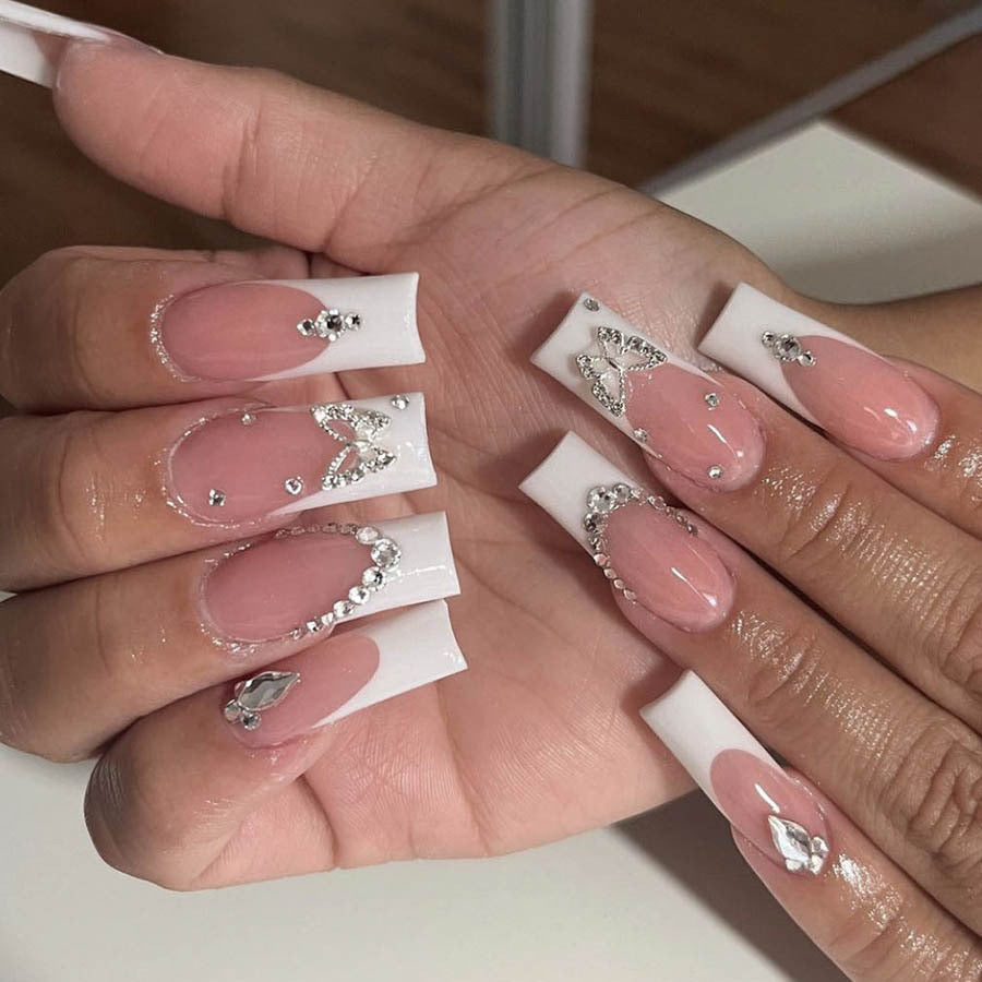 Acrylic nail set with elegant rhinestone and glitter decorations Stornfield