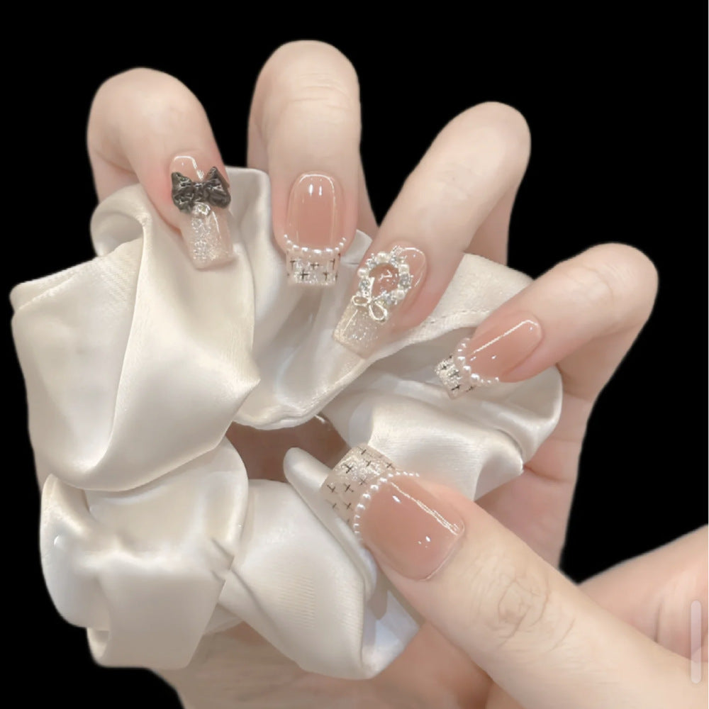 Glamorous artificial nails with sparkling decorations Stornfield