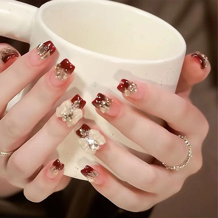 Artificial nails with glamorous floral decorations Stornfield