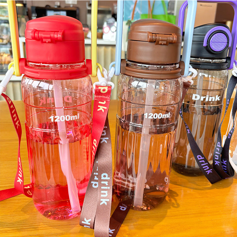 Women's large transparent drinking bottle with integrated carrying handle Stornfield