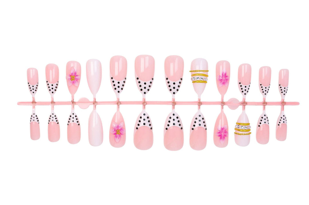 Acrylic nail set with romantic floral patterns and elegant glitter decorations Stornfield