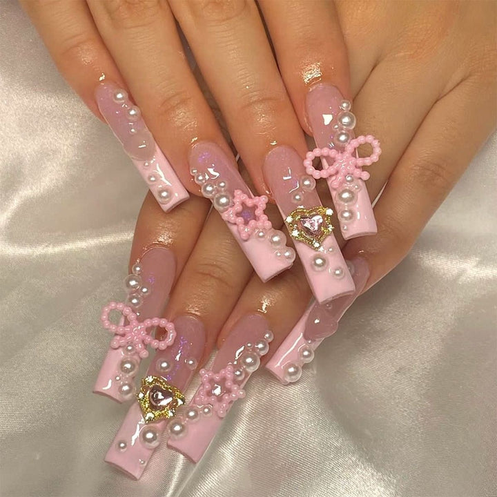 Creative acrylic nail set with delicate pearl and gloss accents Stornfield